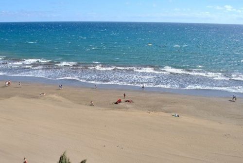 maspalomas beach with moderate waves