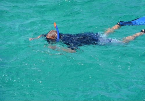 Man snorkelling in clear water